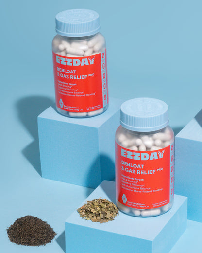 Two bottles of EZZDAY Debloot & Gas Relief Pro on a blue background with herbs.